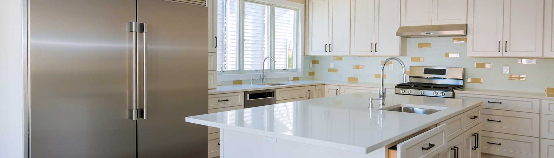 Remodeled kitchen with new flooring and updated cabinetry by A+ Remodeling and Restoration in Angleton, TX